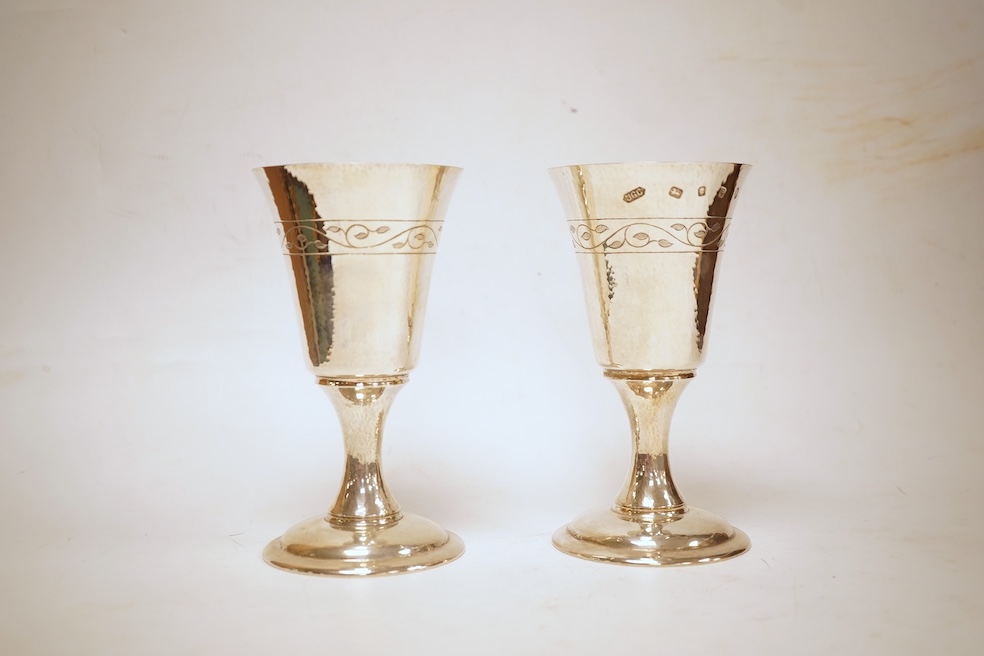 A pair of modern silver Lincoln Cathedral commemorative chalices, no.75 & 76, by John Cussell, London, 1977, 14.7cm, 13oz.